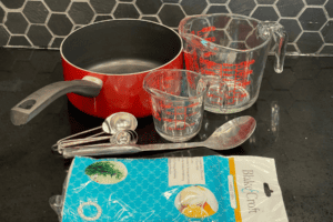 Supplies needed to make sugar-free jelly: saucepan, measuring cups, measuring spoons, cheesecloth, large spoon for skimming